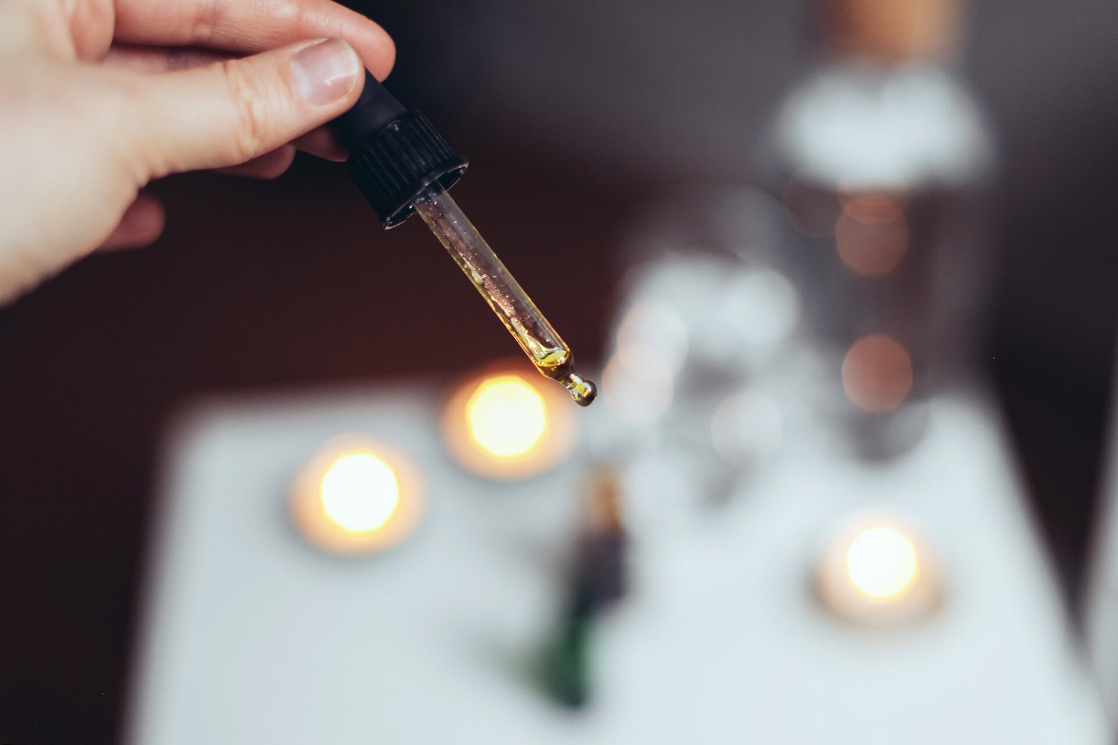 rsz_holding-a-pipette-with-oil-candles-water-spa-atm-2025-10-16-11-33-06-utc
